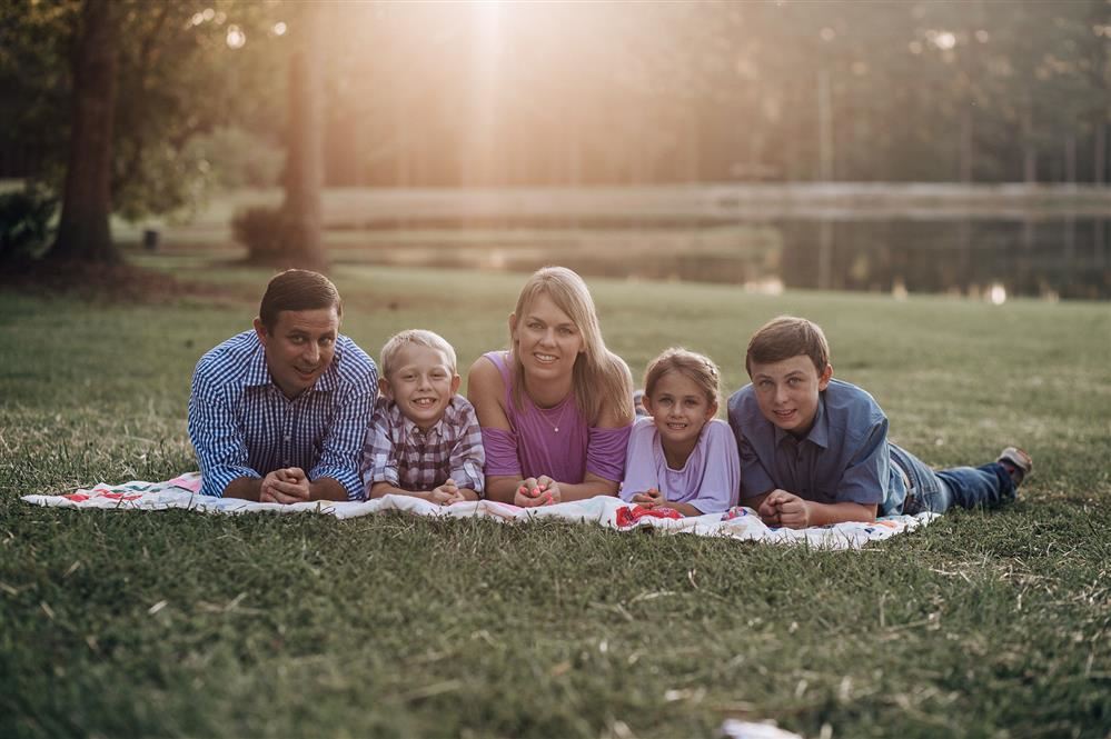 miligan family smiling on the grass
