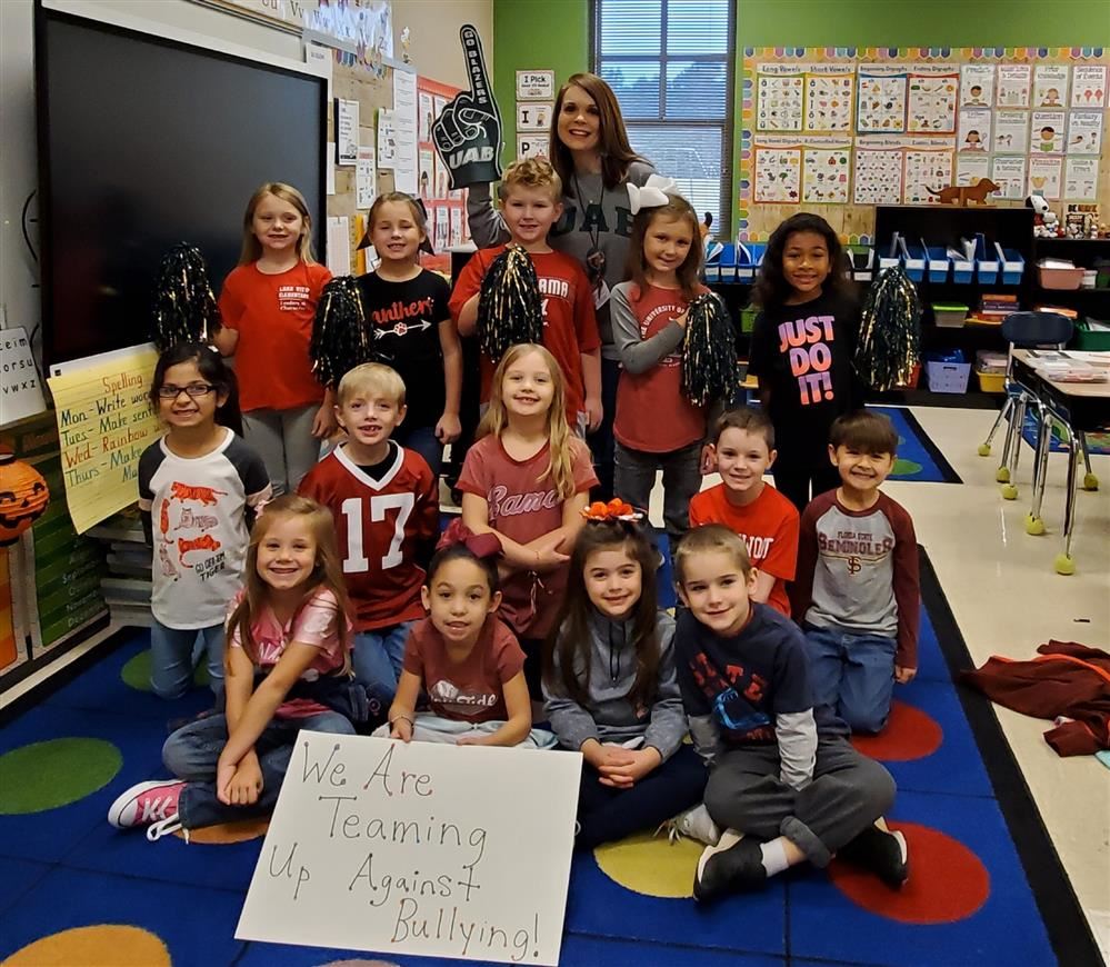 Elementary students dressed in team colors. Elementary students dressed in team colors.