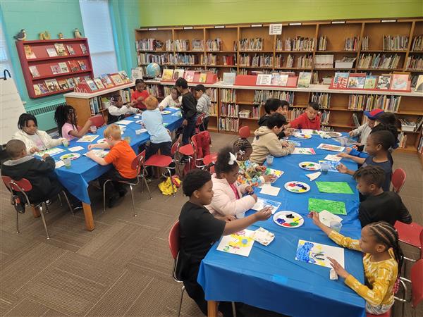 Emerging Super Leaders are enjoying a cookie and painting party for meeting their 3rd Nine Week Accelerated Reading Goals! Showing Unity, these 3rd and 4th grade students work together.